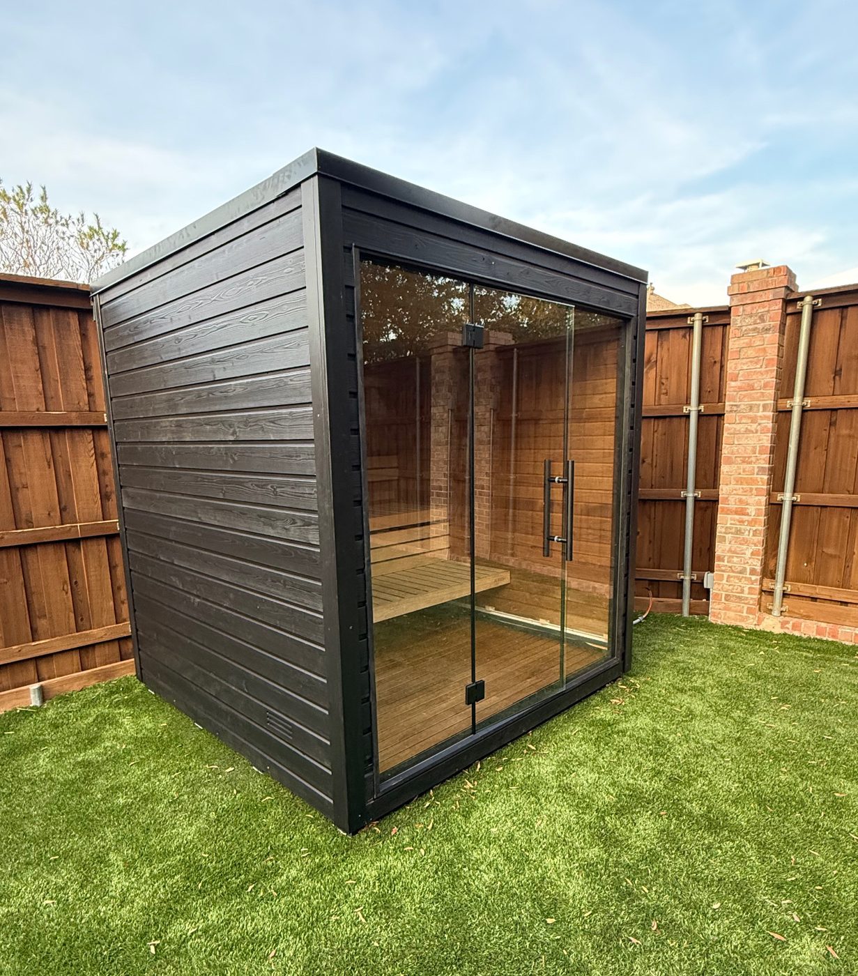 Custom-built modern outdoor cabana with glass doors