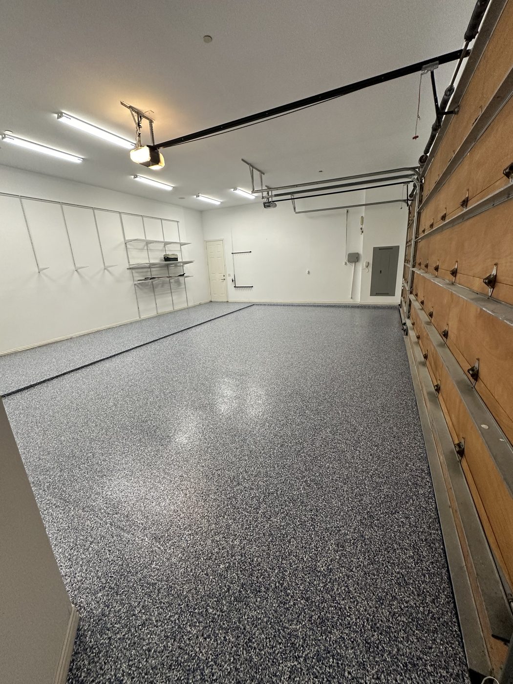 Finished flake epoxy garage floor with custom storage